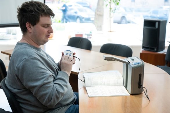 A,Visually,Impaired,Man,Uses,A,Scanning,And,Reading,Machine.