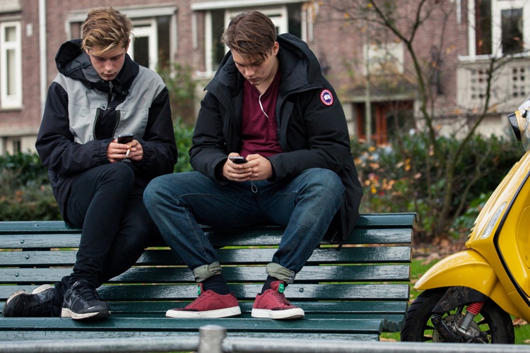 Amsterdam,,Netherlands,-,October,26:,Two,Teenagers,Sit,On,The