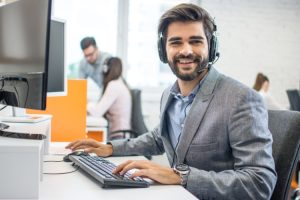 Smiling,Friendly,Handsome,Young,Male,Call,Centre,Operator,At,Office